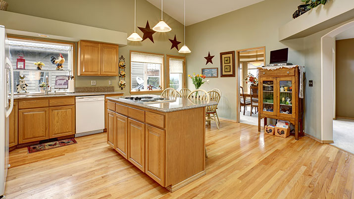 Beautiful kitchen with a hardwood floor that has just been professionally cleaned and sealed.